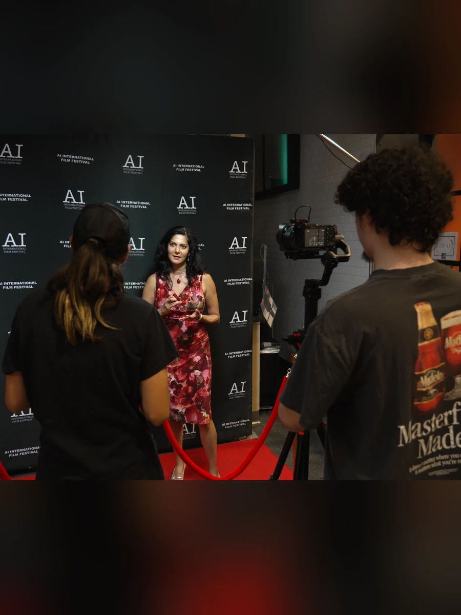 A filmmaker interviewed on the red carpet